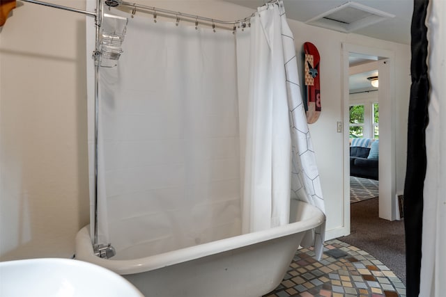 bathroom with shower / bathtub combination with curtain