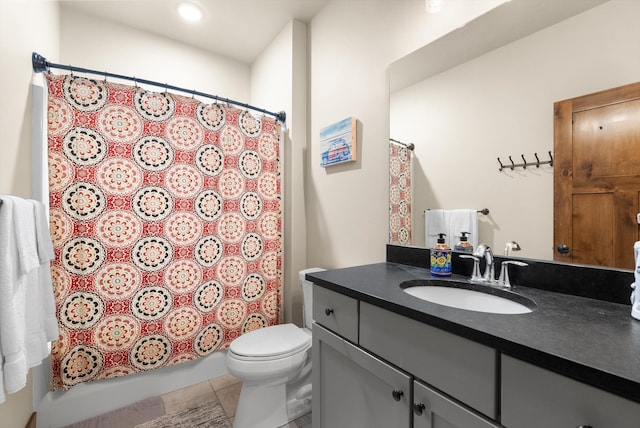 full bathroom with shower / bathtub combination with curtain, tile patterned flooring, vanity, and toilet