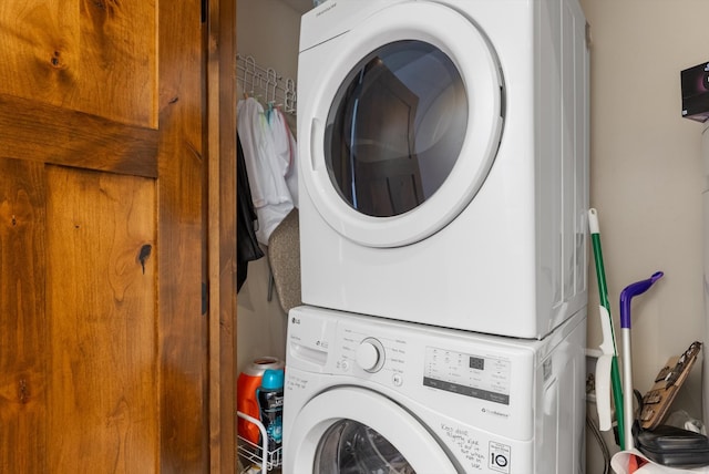 washroom with stacked washer / dryer