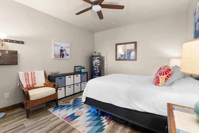 bedroom with ceiling fan and hardwood / wood-style flooring