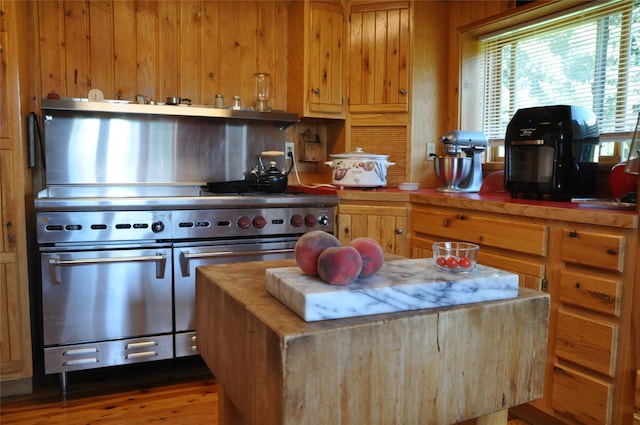 1876 Timber Creek Rd, Haugan, MT 59866 - kitchen featuring range with two ovens, butcher block counters, and wood finished floors