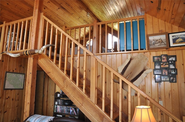 1876 Timber Creek Rd, Haugan, MT 59866 - stairway featuring wooden walls, vaulted ceiling, and wood ceiling