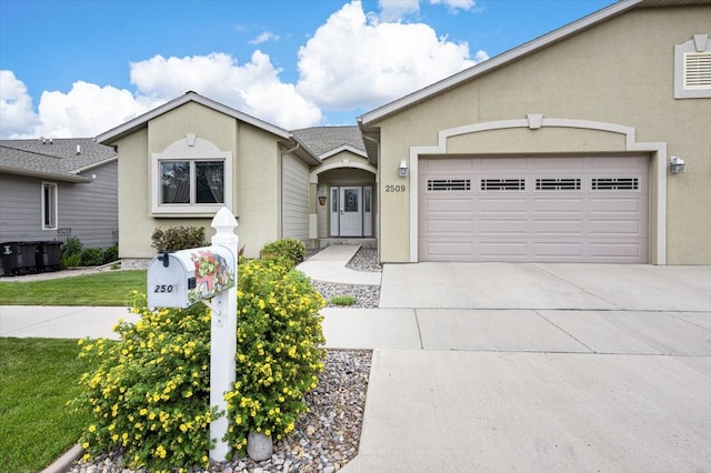 single story home with a front yard and a garage