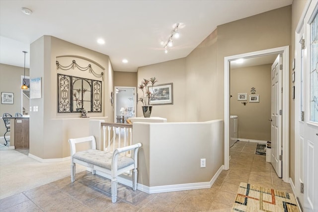 hall featuring light tile patterned floors