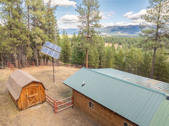 birds eye view of property featuring a mountain view