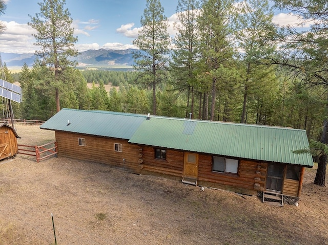 view of horse barn featuring a mountain view