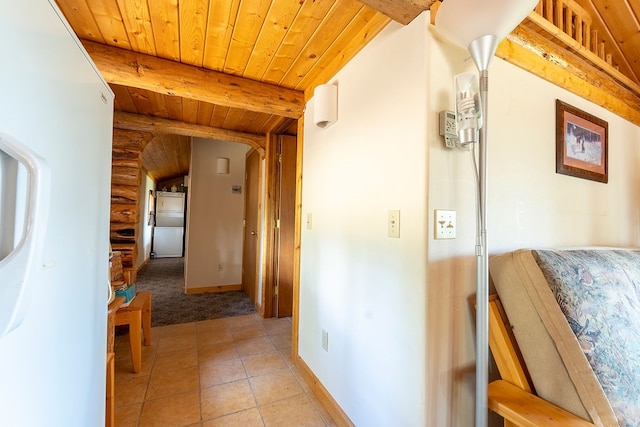 hall featuring wood ceiling, vaulted ceiling with beams, and light tile patterned floors