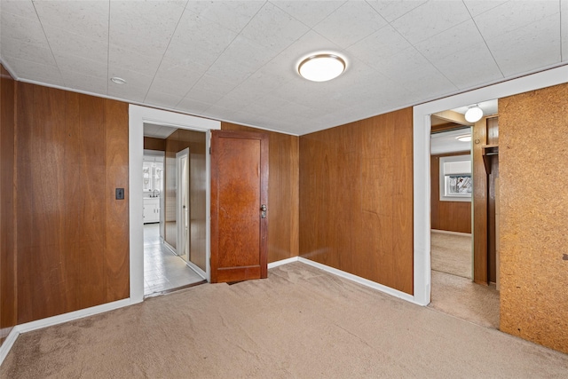161 3rd Ave, Kalispell, MT 59901 - empty room with carpet floors and wooden walls