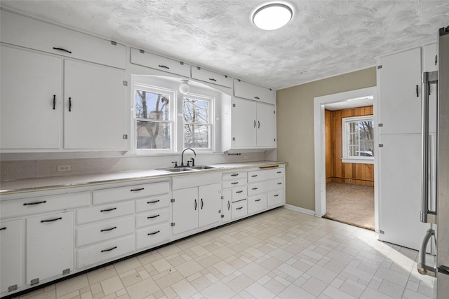 161 3rd Ave, Kalispell, MT 59901 - kitchen featuring light countertops and white cabinets