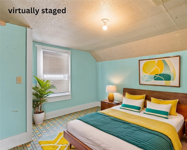 161 3rd Ave, Kalispell, MT 59901 - bedroom featuring lofted ceiling and a textured ceiling
