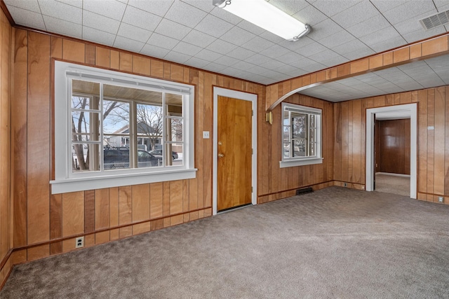 161 3rd Ave, Kalispell, MT 59901 - carpeted spare room with wooden walls and arched walkways