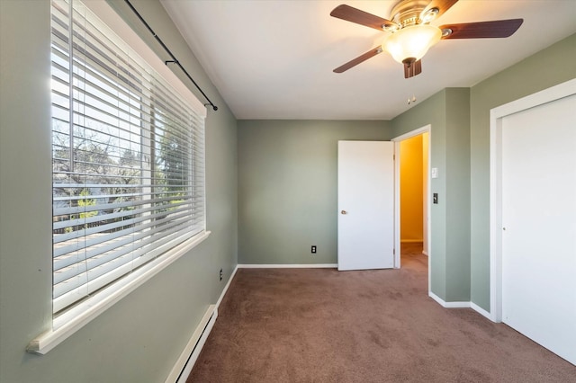 unfurnished bedroom featuring baseboards, ceiling fan, and carpet floors