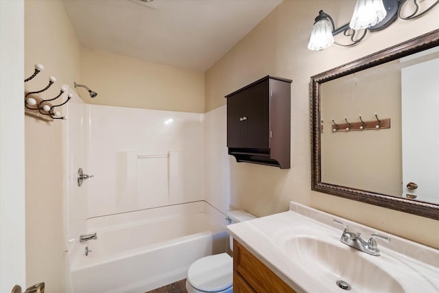 bathroom with toilet, shower / tub combination, and vanity