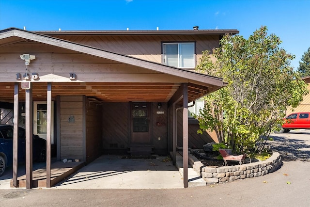 view of front of house featuring an attached carport
