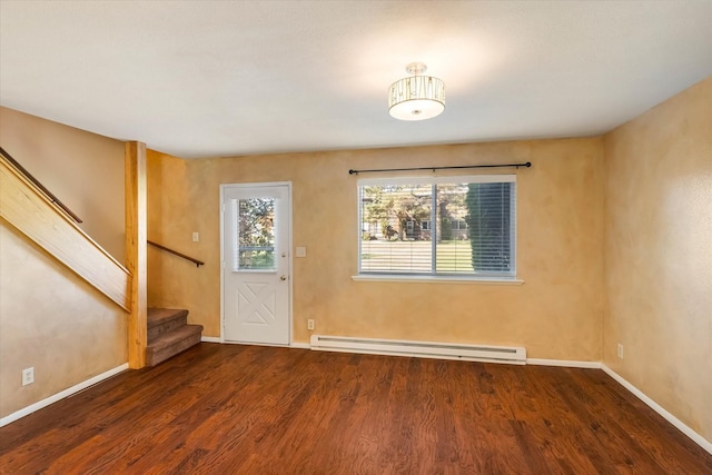 foyer with baseboards, stairway, a baseboard heating unit, and wood finished floors