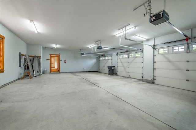 garage featuring a garage door opener