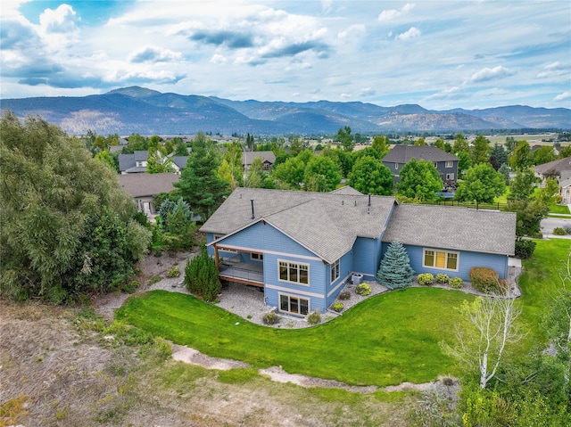 birds eye view of property featuring a mountain view