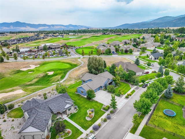 birds eye view of property with a mountain view