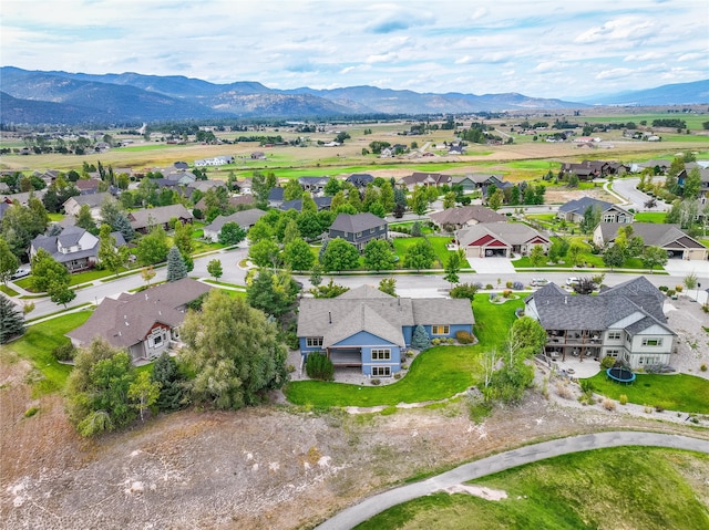 birds eye view of property with a mountain view