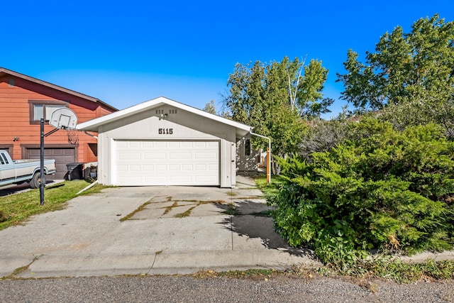 exterior space with driveway and a garage
