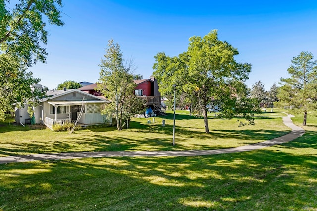 view of property's community featuring a yard