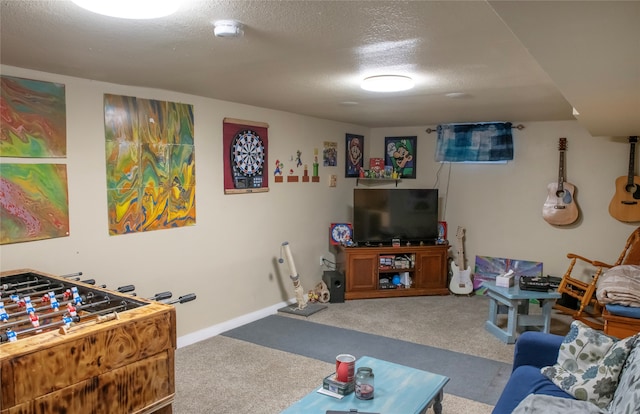 playroom featuring carpet floors and a textured ceiling