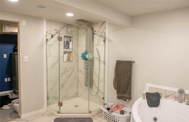 bathroom featuring shower with separate bathtub and tile patterned floors