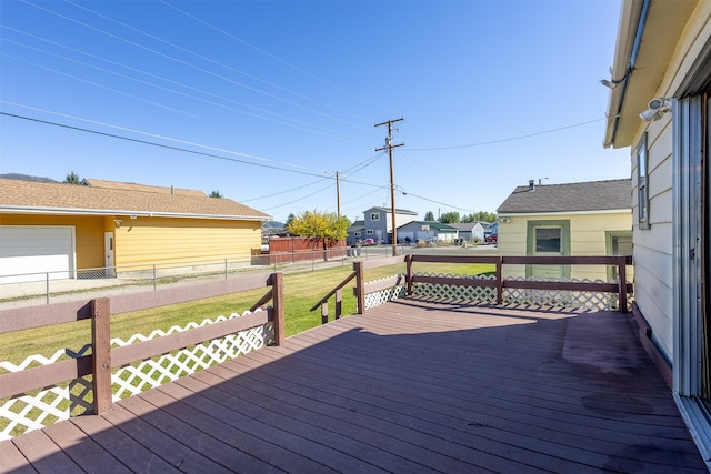 deck featuring fence and a lawn