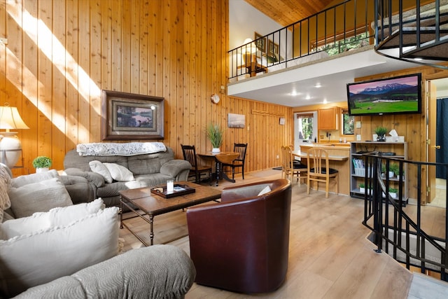 114 Cedar Way Unit 114, Whitefish, MT 59937 - living area featuring high vaulted ceiling, wood walls, and wood finished floors