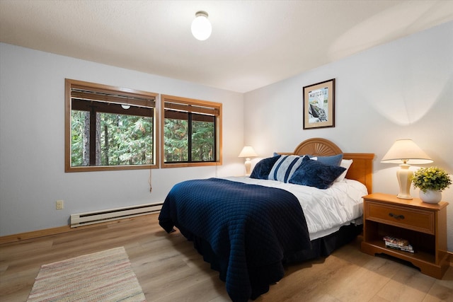 114 Cedar Way Unit 114, Whitefish, MT 59937 - bedroom with a baseboard radiator and wood finished floors