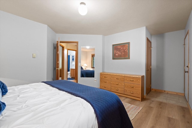 114 Cedar Way Unit 114, Whitefish, MT 59937 - bedroom featuring light wood-style flooring and baseboards