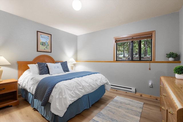 114 Cedar Way Unit 114, Whitefish, MT 59937 - bedroom featuring baseboard heating and light wood-style flooring