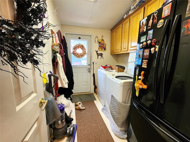 clothes washing area featuring carpet floors, separate washer and dryer, and cabinets