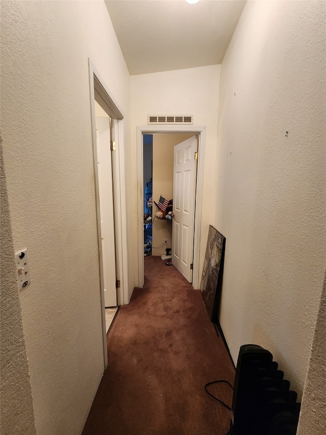 hallway with carpet