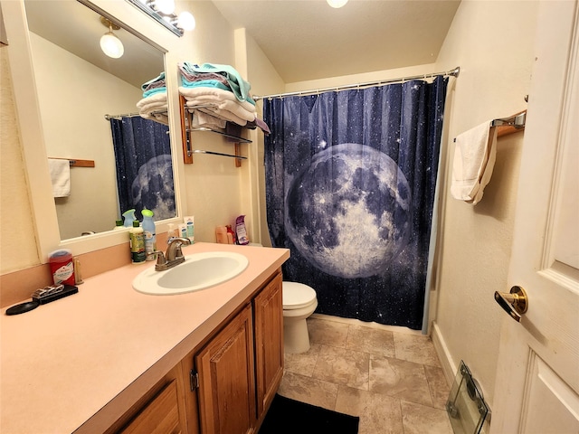 bathroom with walk in shower, vanity, and toilet