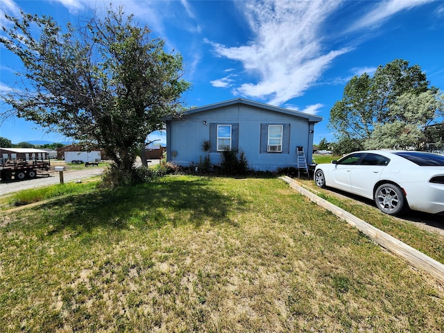 ranch-style house with a front lawn