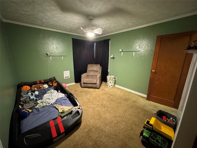 bedroom featuring carpet floors, ornamental molding, baseboards, and a ceiling fan