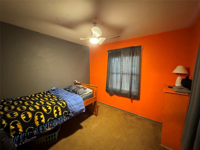 carpeted bedroom featuring visible vents and a ceiling fan