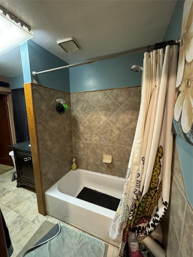 bathroom with shower / bath combo with shower curtain