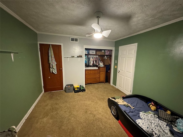 bedroom with crown molding, light colored carpet, a ceiling fan, and visible vents