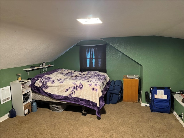 carpeted bedroom featuring baseboards and vaulted ceiling
