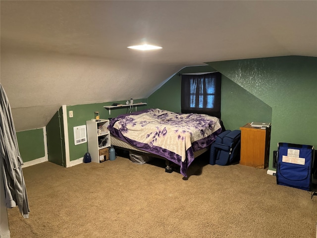 carpeted bedroom with vaulted ceiling