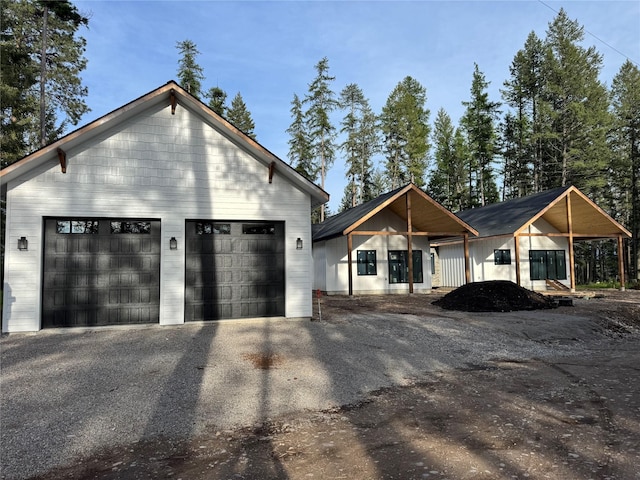 modern farmhouse with a detached garage