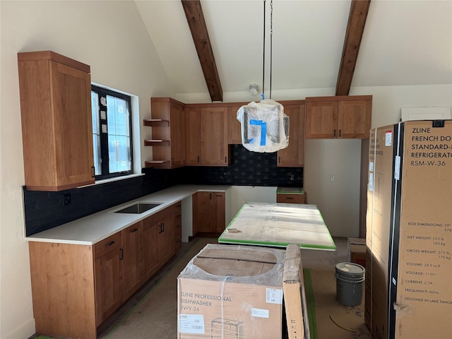 kitchen with freestanding refrigerator, backsplash, open shelves, a sink, and light countertops