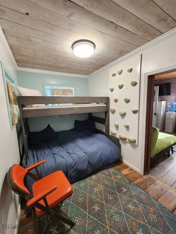 bedroom with wood-type flooring, wooden ceiling, and crown molding