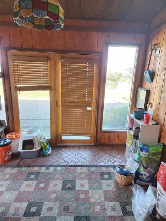 doorway with wooden walls