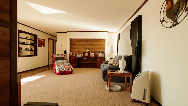 sitting room featuring crown molding and carpet