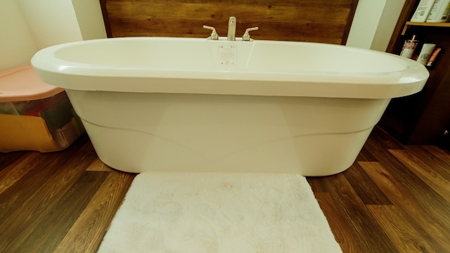 bathroom featuring a tub and hardwood / wood-style floors