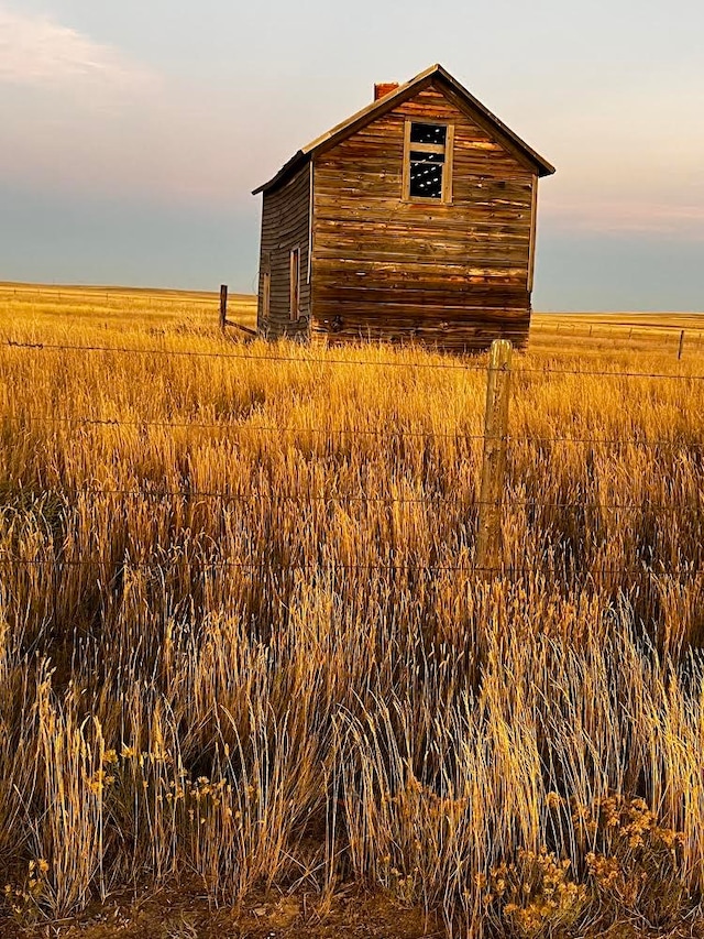 exterior space with an outbuilding and a rural view