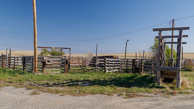 view of yard with a rural view